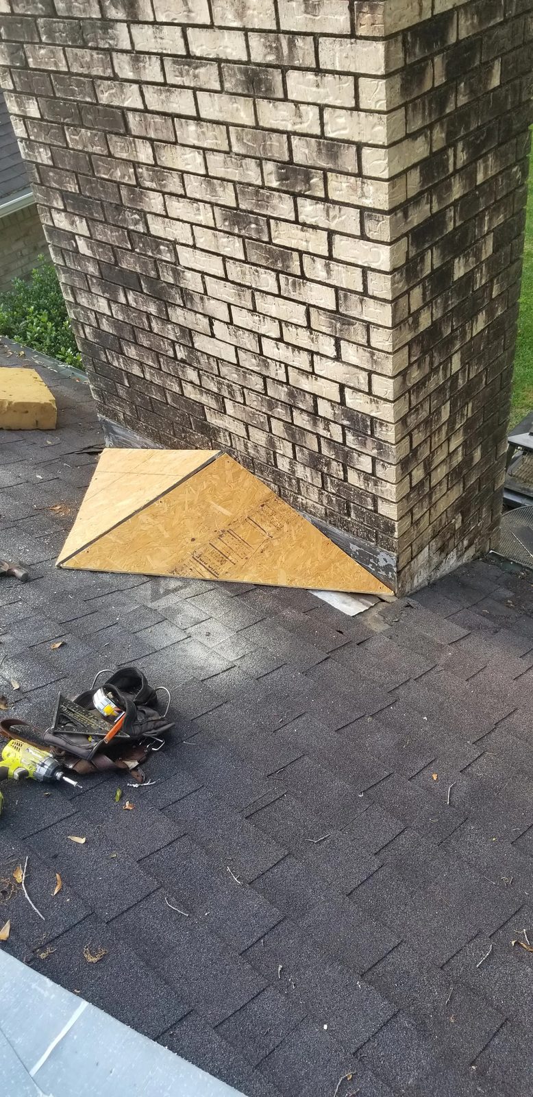 New plywood decking installed at chimney during flashing repair