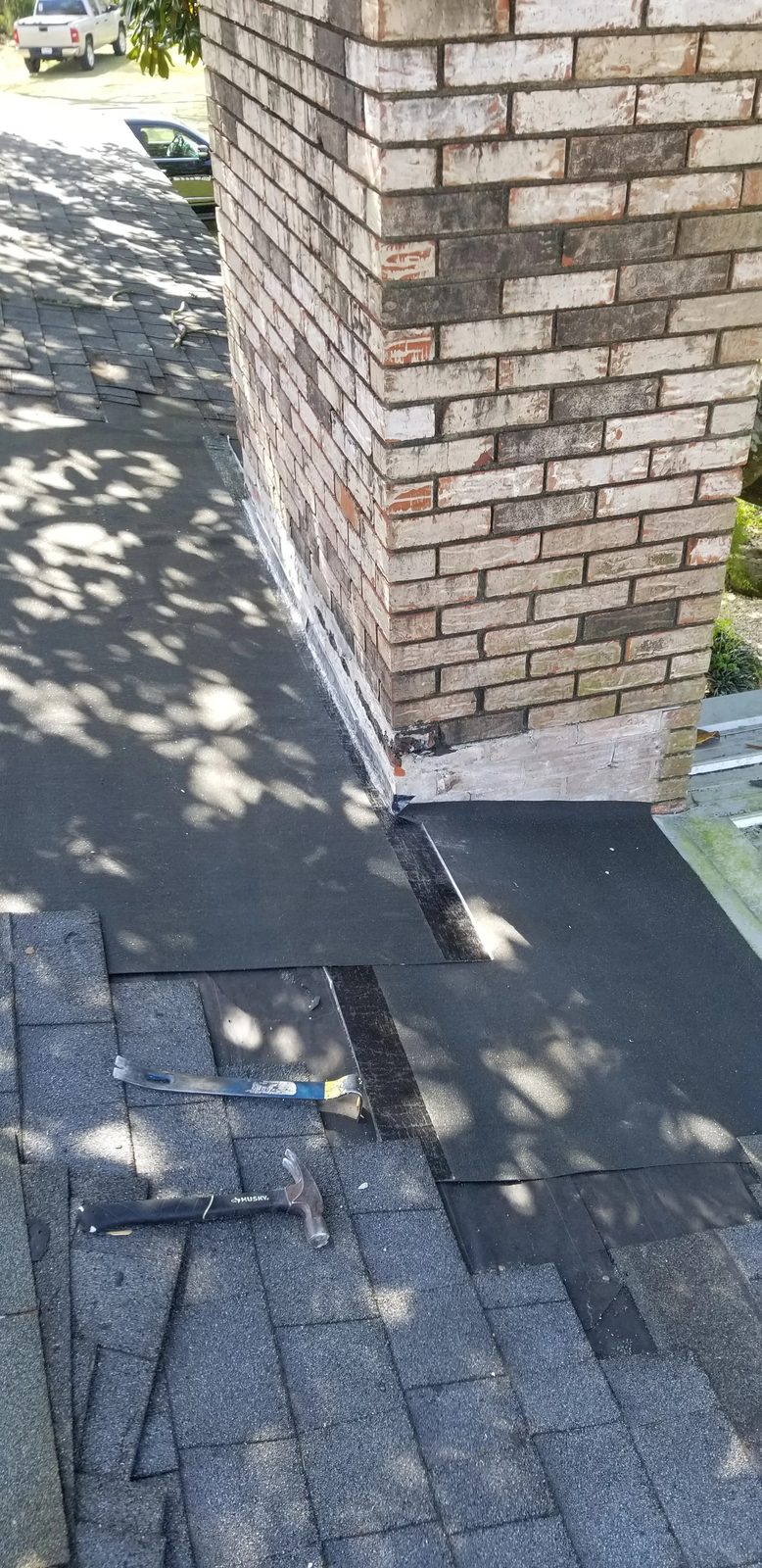Waterproof underlayment installed at chimney base